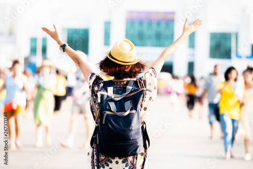 Woman asia traveler with backpack enjoying among many people,Freedom and active lifestyle concept  photo