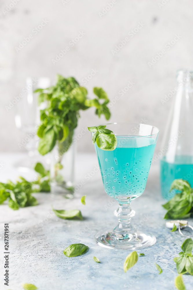 Colorful refreshing summer drink with basil seeds on light background. Colorful refreshing summer drink with basil seeds on light background.