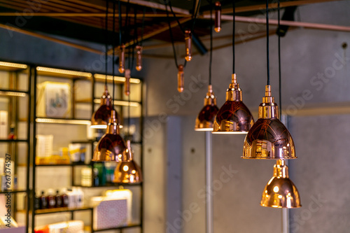 Modern and industrial style lamps in the interior of a beauty salon or restaurant. Loft-style designe interior