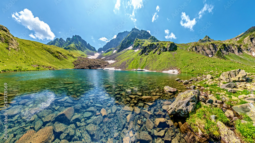 Turquoise water in lake Kalalish with peaks in background, Svaneti mountains, Georgia, Asia - obrazy, fototapety, plakaty 