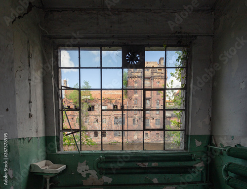 Szczecin. abandoned factory premises with historic architecture outside the window