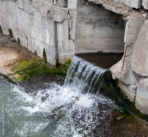 Run-off pipe discharging water photo