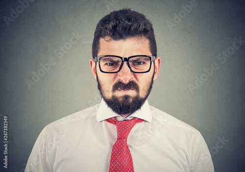 Obraz na plátně Angry grumpy man looking very displeased