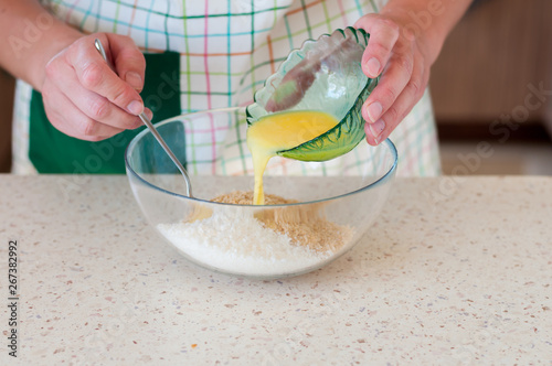 Tableau sur toile Female Adding Butter To Crushed Biscuits