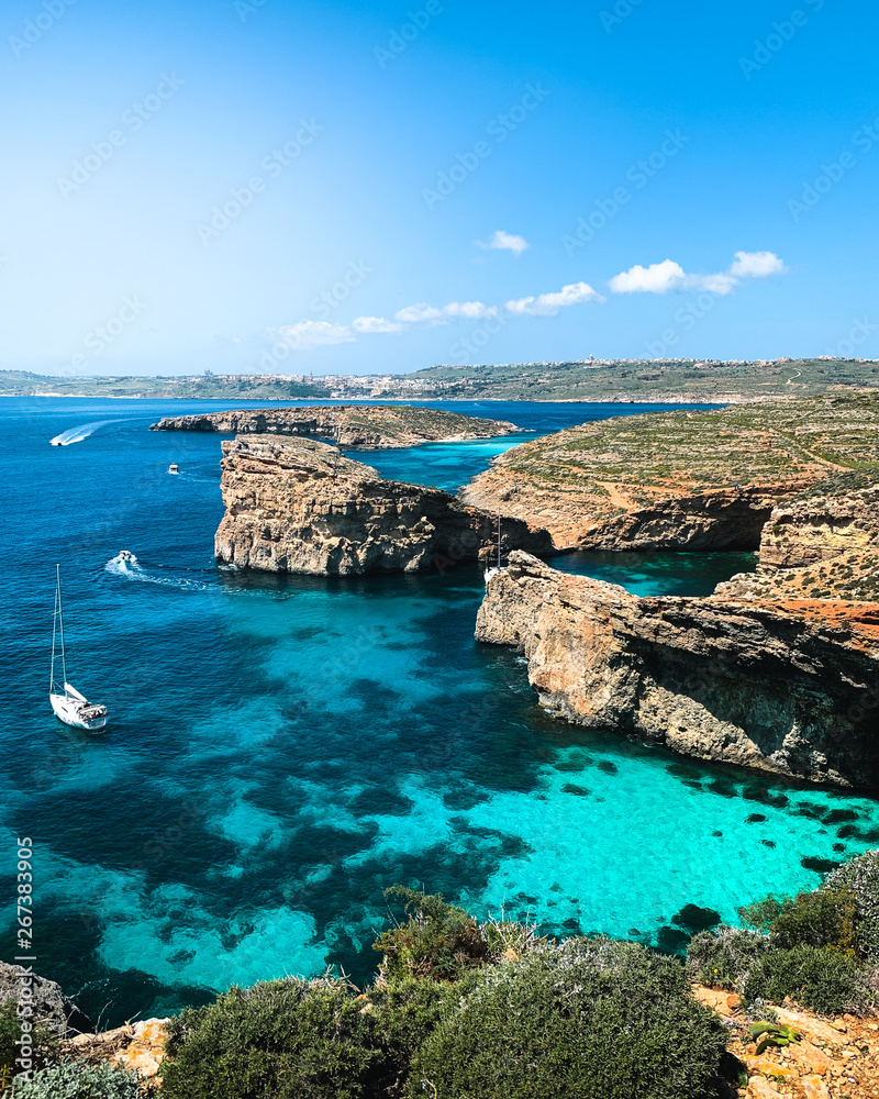 Blue lagoon in Comino Island, Malta. Nature summer seascape in Malta. Travel and tourism in Malta concept.