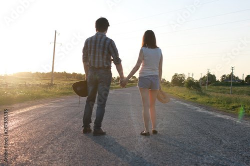 Cute couple on a walk by the countryside