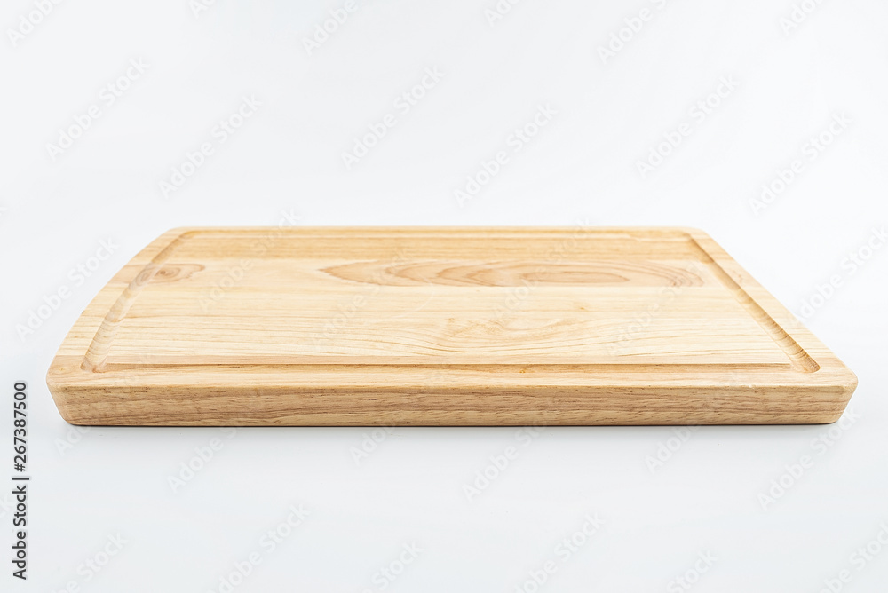 a wooden chopping board on a white background a wooden chopping board on a white background