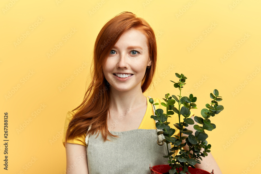 cute positive girl selling flowers. close up photo. job, profession, occupation concepts. business cute positive girl selling flowers. close up photo. job, profession, occupation concepts. business