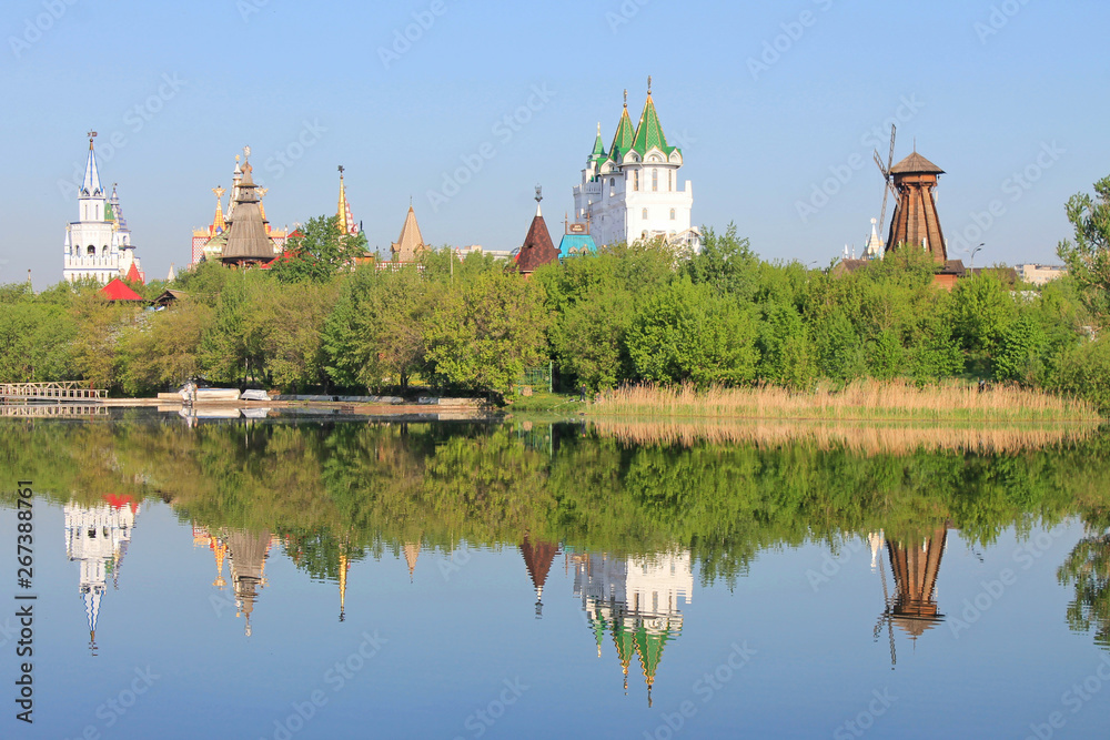 Kremlin in Izmailovo in Moscow Russia early spring morning with reflection in the blue water of the pond