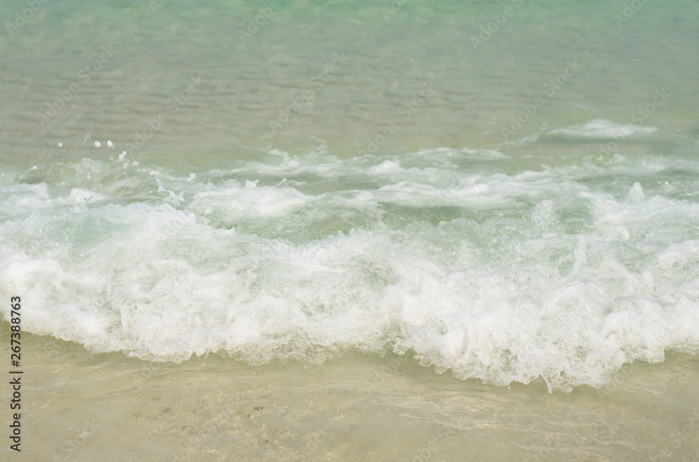 beautiful the beach closeup smooth sand and blue sea water. vacation background on summer in Thailand. beautiful the beach closeup smooth sand and blue sea water. vacation background on summer in Thailand.