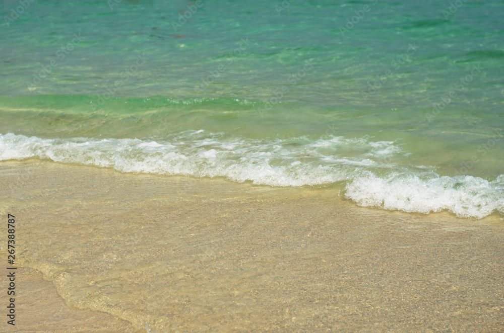 beautiful the beach closeup smooth sand and blue sea water. vacation background on summer in Thailand. beautiful the beach closeup smooth sand and blue sea water. vacation background on summer in Thailand.