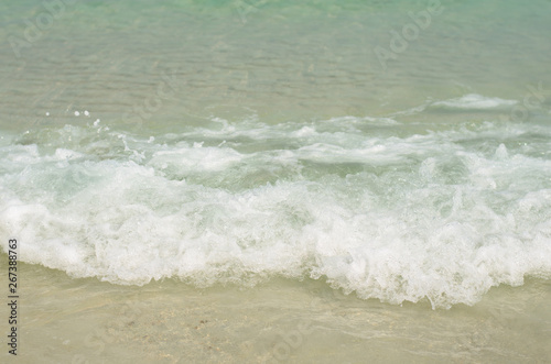 beautiful the beach closeup smooth sand and blue sea water. vacation background on summer in Thailand.