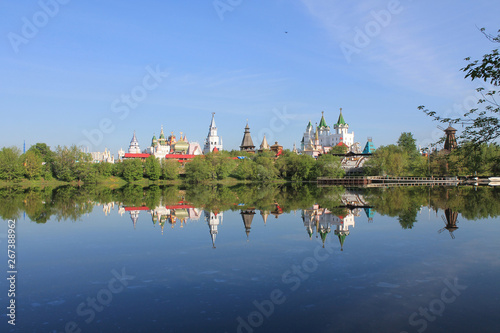 Kremlin in Izmailovo in Moscow Russia early spring morning with reflection in the blue water of the pond