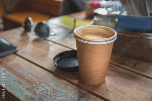 Take away coffee cup on wooden table