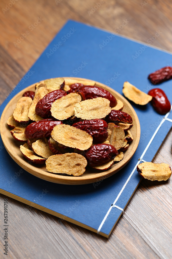 Red jujube slices in wooden plate Red jujube slices in wooden plate