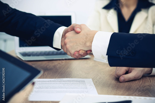 Business people shaking hands at meeting or negotiation in the office. Handshake concept. Partners are satisfied because signing contract