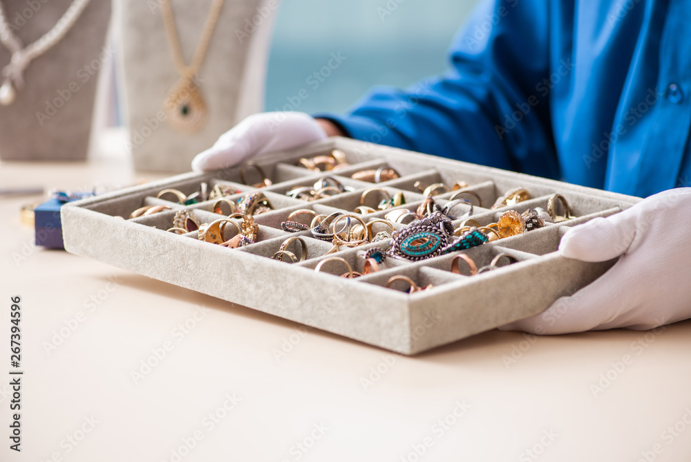 Young jeweler working in his workshop Young jeweler working in his workshop