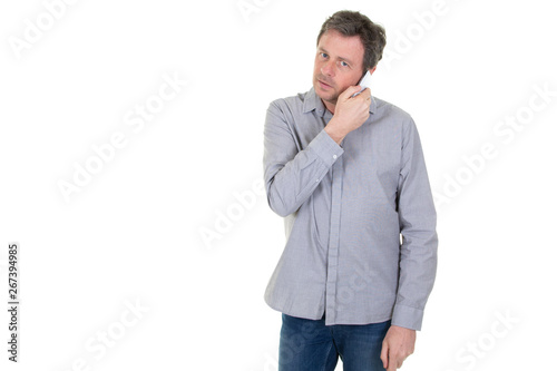 handsome man listening on a phone on a white background © OceanProd