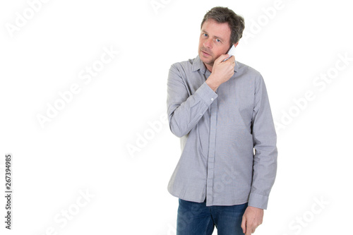 handsome man listening on a phone on a white background