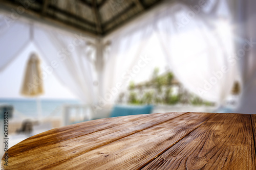 Table background of free space and beach lodge window  © magdal3na