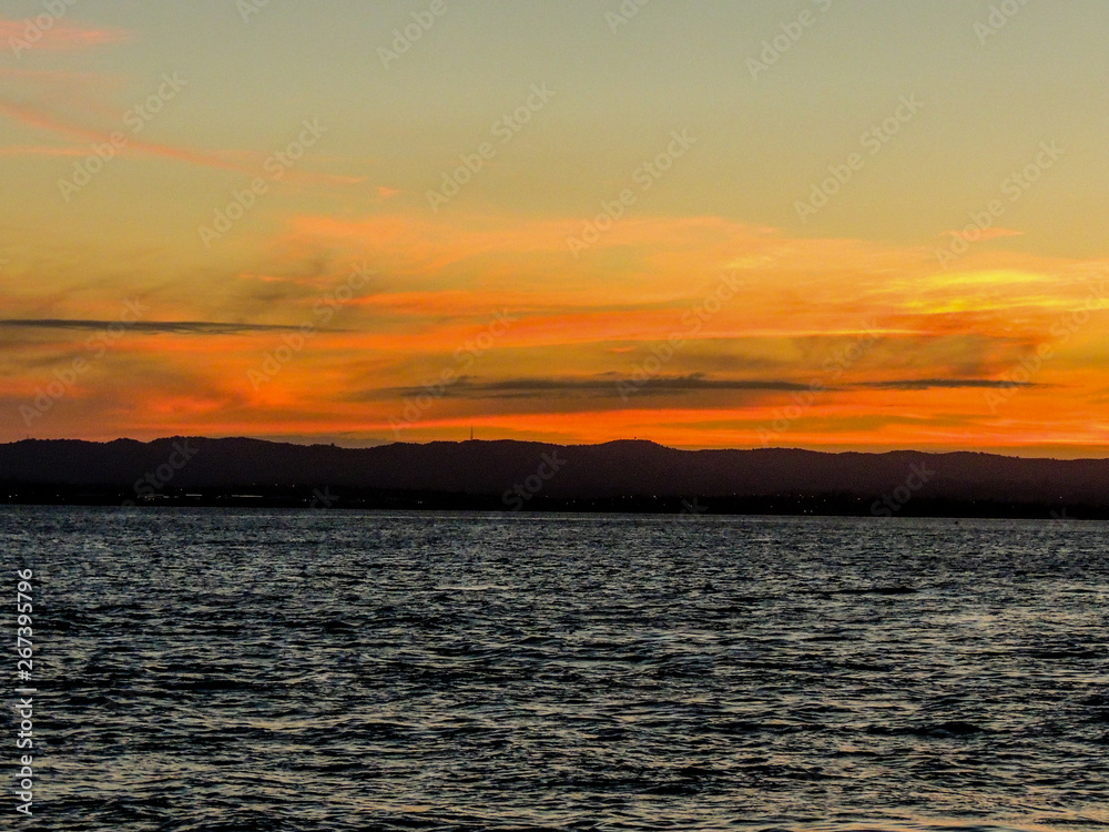 Sunset over the harbour, from the Birkenhead Whard, Waitemata Harbour, Auckland, New Zealand