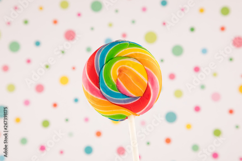 Lollipop, Rainbow colored lollipop isolated on white colorful dotted retro vintage background