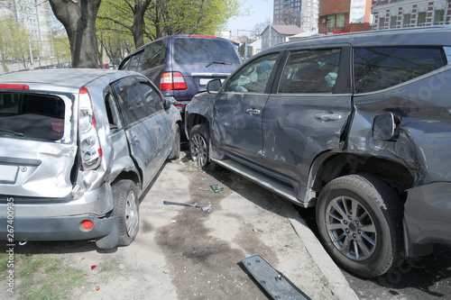 big cars accident on the road in the city, broken cars closeup, traffic accident, multiple car crash photo