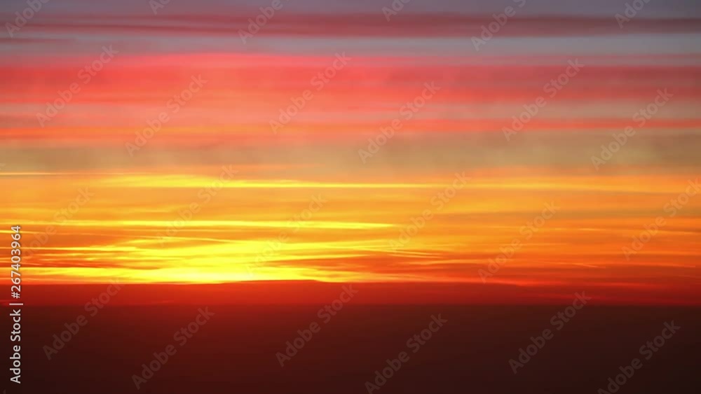 flying over clouds on sunrise background flying over clouds on sunrise background