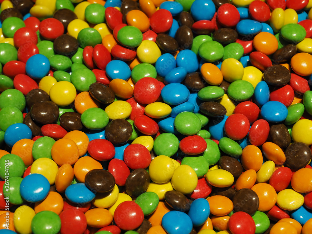 Lot of colorful chocolate drops Lot of colorful chocolate drops