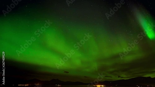 Timelapse of amazing beautiful green Northern Light or Aurora Borealis or Polar Light in the night sky