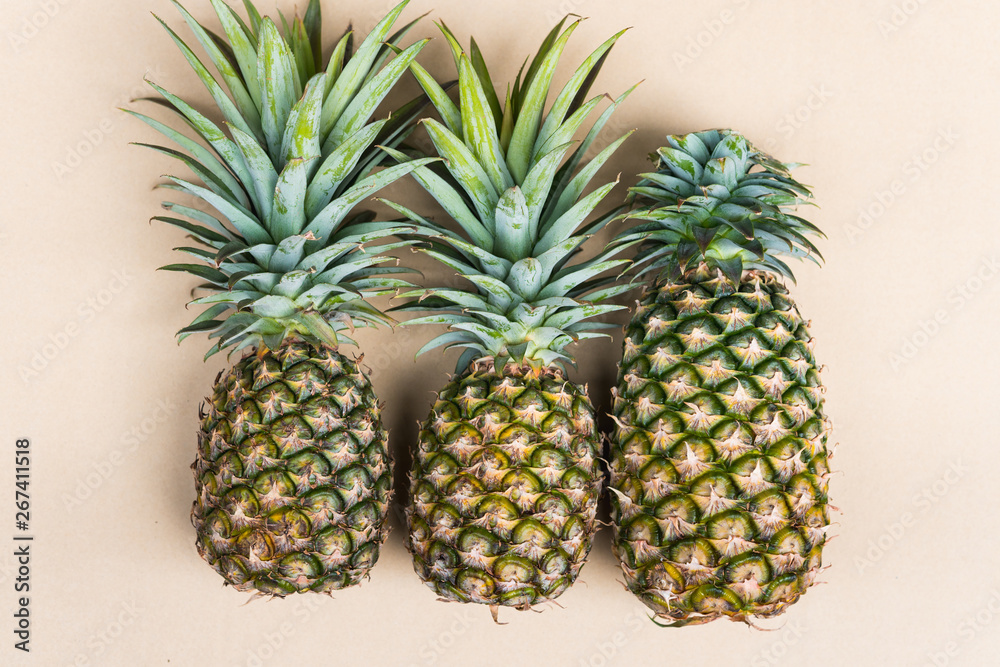 Fototapeta premium High angle view of fresh pineapple on grey background