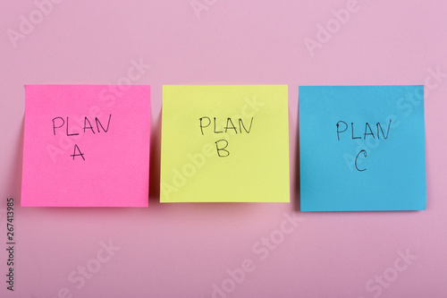 Plan a, plan b or plan c on colorful office stickers on pink background