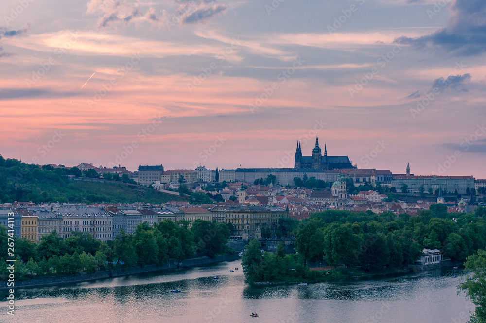 Colorful sunset sky above Old Prague castle and Vltava river