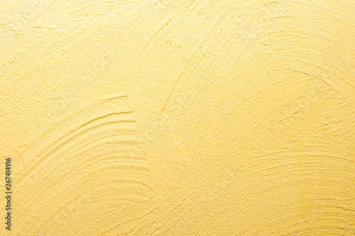 abstrakter, strukturierter Hintergrund: gelber Putz