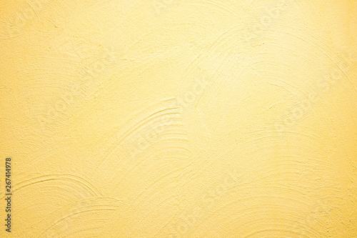 abstrakter, strukturierter Hintergrund: gelber Putz