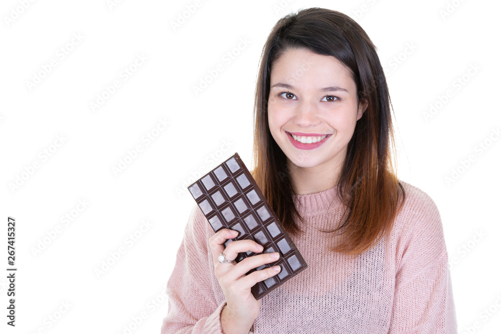 Portrait of pretty satisfied pretty girl ready to bit chocolate bar on white background aside blank copy space Portrait of pretty satisfied pretty girl ready to bit chocolate bar on white background aside blank copy space