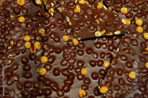 black chocolate bricks with nuts for background