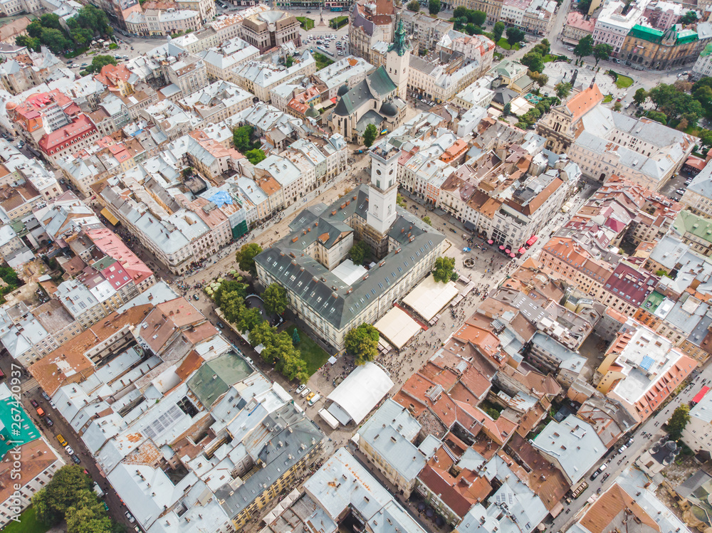 aerial view old european city with red roofs. city hall tower