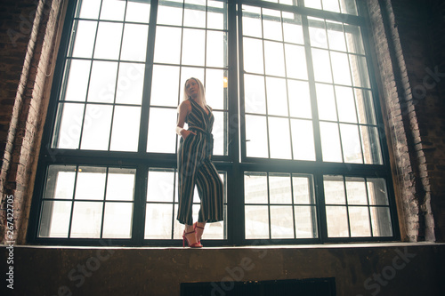 young woman at the panoramic window