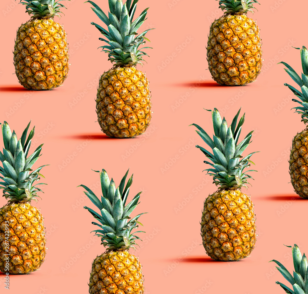 Many pineapples on a solid color background Many pineapples on a solid color background