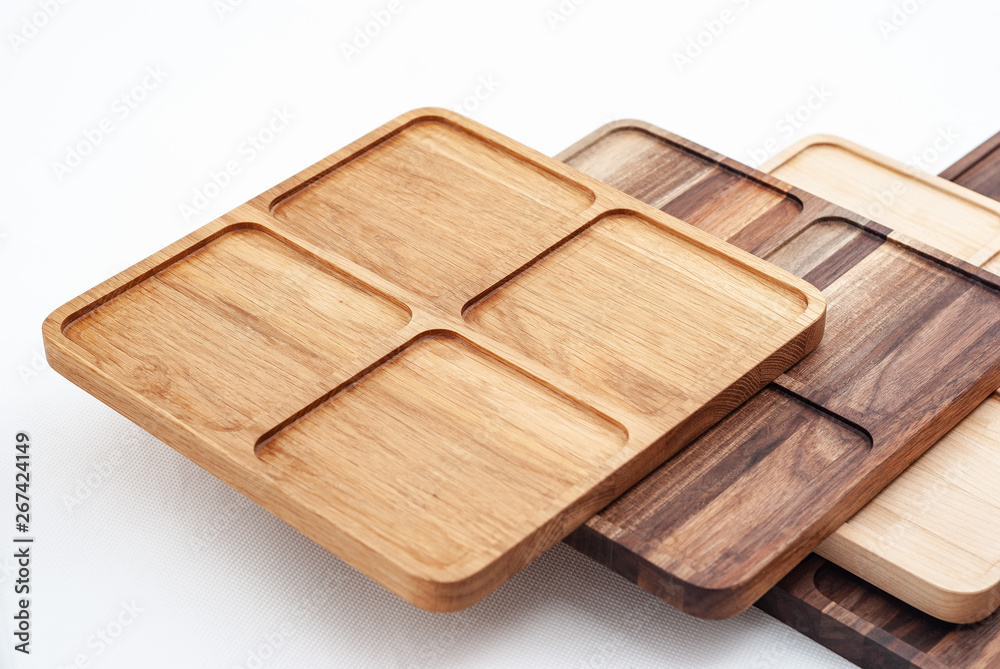 Shaped wooden boards in row on white background