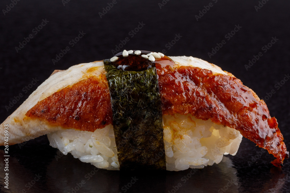 Classic sushi roll. Sushi at black background.Japanese seafood sushi , sushi a black background. Classic sushi roll. Sushi at black background.Japanese seafood sushi , sushi a black background.
