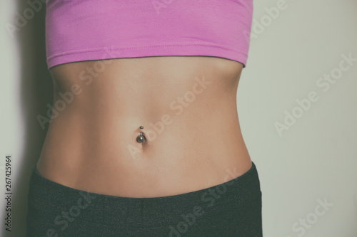 Close up stomach of a sporty woman with abs .Toned photo