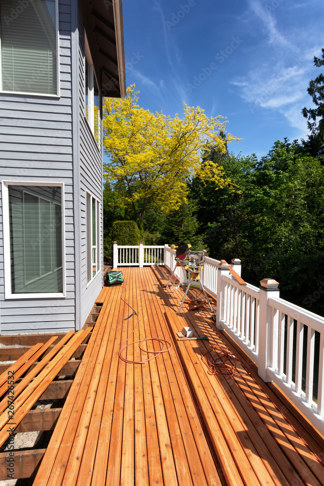 Outdoor wooden deck being completely remodeled during springtime - obrazy, fototapety, plakaty 