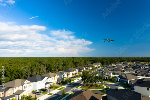 Camera drone hovering over a developing neighborhood