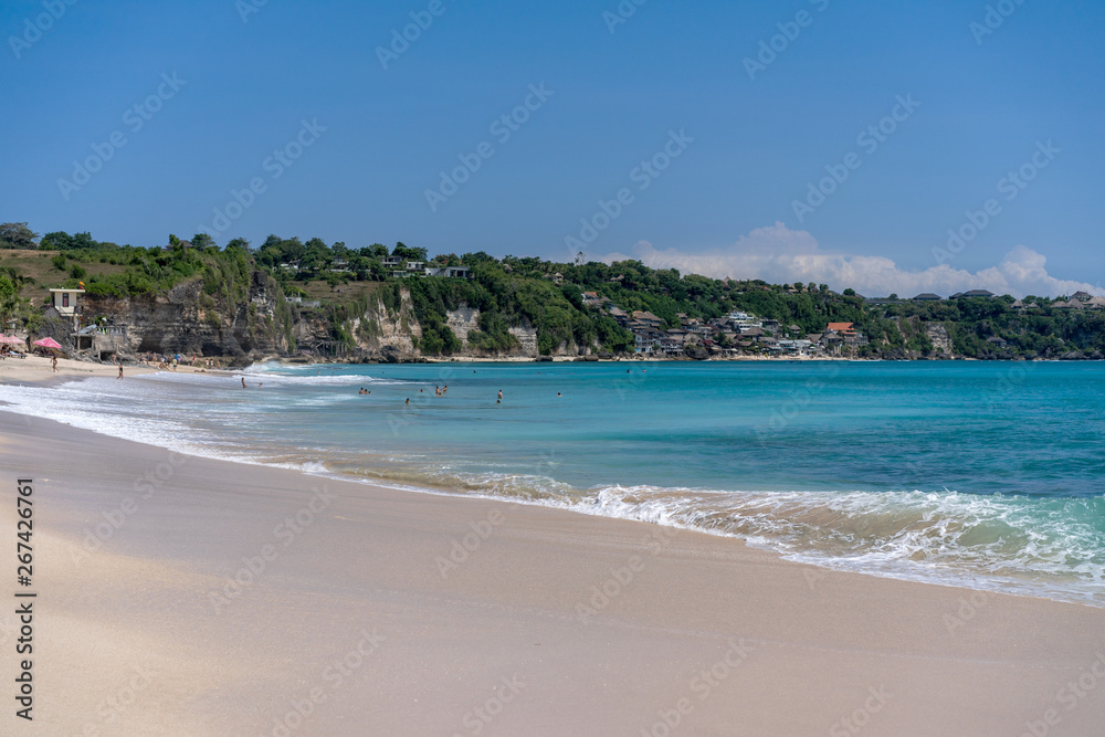 tropical wide beach with rocks