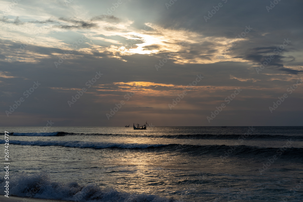 ship in the ocean at sunset