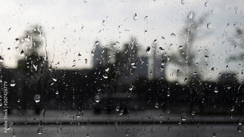 View on Moscow City. Drops from the rain on the glass of a car, the urban landscape in defocusing. Background with blurred urban landscape and drops on the glass.