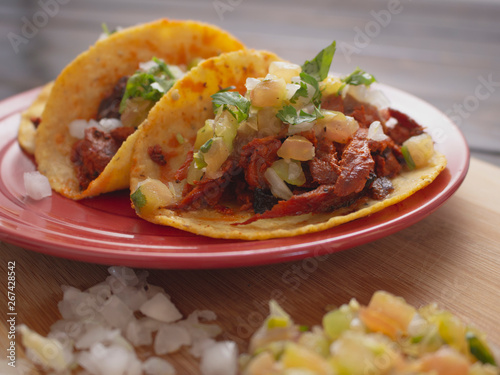 Soft Tortilla Tacos with Spicy Sauce and Tomato Onion and Cilantro 