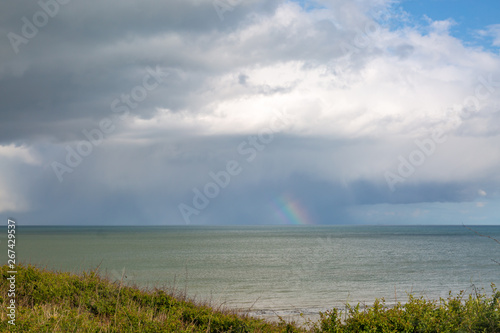Looking out to sea near Eastbourne in Sussex, with part of a rainbow on the horizon